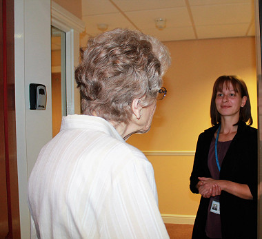 Stock photo waiter serving senior couple eating at vegan restaurant retired man and woman on active elderly